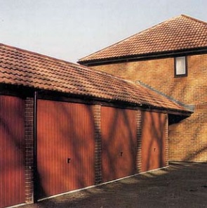 Extended roof construction links garages with dwelling to identify entry to the garage forecourt. - Economy garages are a cost-effective and practical choice